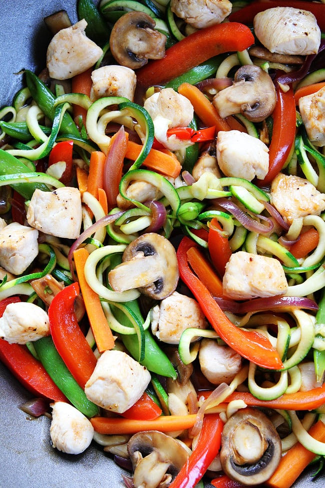 Easy Chicken Zucchini Noodle Stir Fry Recipe on twopeasandtheirpod.com You only need 30 minutes to make this healthy and delicious dinner! Kids love it too! Easy Chicken Zucchini Noodle Stir Fry Recipe