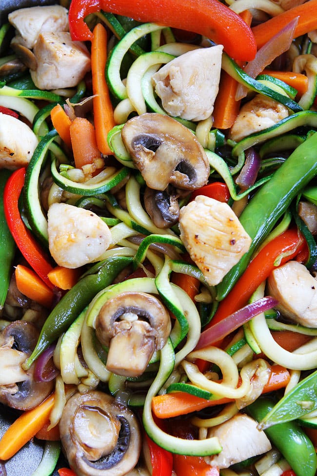 Easy Chicken Zucchini Noodle Stir Fry Recipe on twopeasandtheirpod.com This zucchini noodle stir fry is fun to make and fun to eat! And it only takes 30 minutes! Easy Chicken Zucchini Noodle Stir Fry Recipe