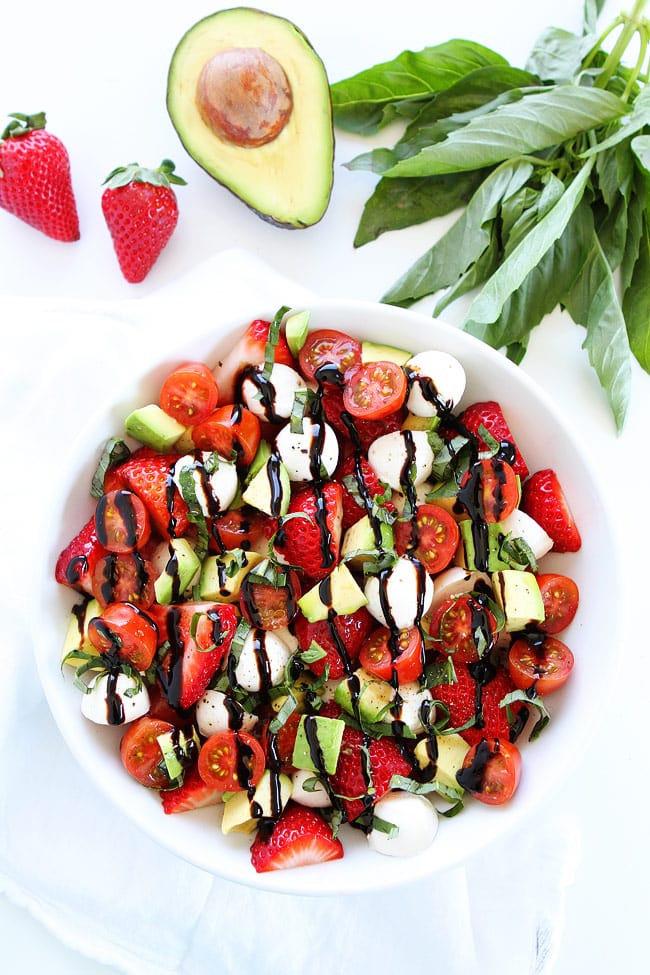 Avocado Strawberry Caprese Salad Recipe on twopeasandtheirpod.com This simple spring salad is amazing! You have to try it! Fresh Caprese Salad Recipe including strawberries and avocado