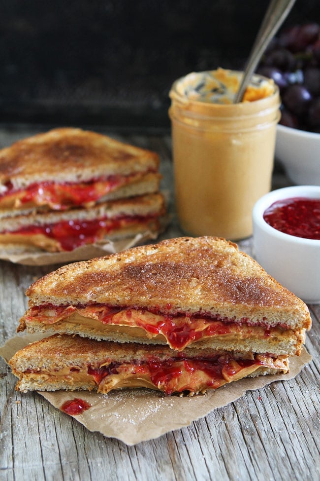 Cinnamon Sugar Toast PB&J Recipe on twopeasandtheirpod.com Two classics come together to create the BEST PB&J sandwich! Kids and adults will love this easy sandwich! Cinnamon Sugar Toast PB&J Recipe