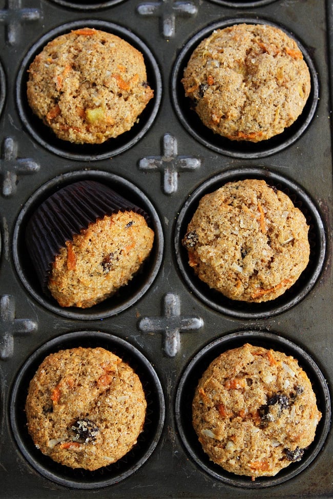 Morning Glory Muffin Recipe on twopeasandtheirpod.com Whole wheat muffins packed with pineapple, carrots, coconut, and raisins. These healthy muffins are great for breakfast on the go! Morning Glory Muffins in muffin tin