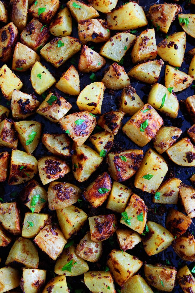 Mustard Crusted Potatoes Recipe on twopeasandtheirpod.com This easy potato recipe is a favorite at our house! The potatoes make a great side dish for any meal! Mustard Crusted Potatoes Recipe