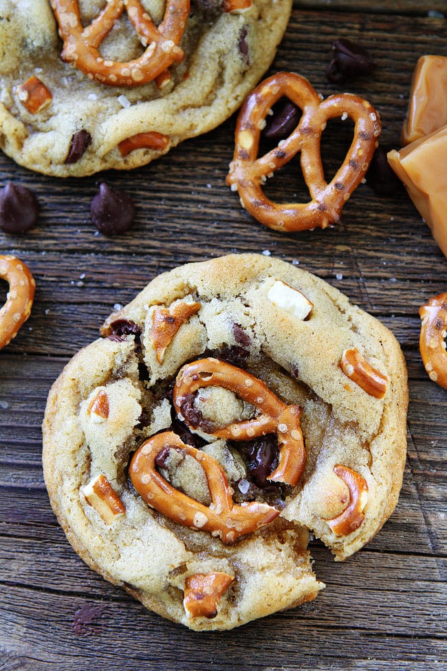 Salted Caramel Pretzel Chocolate Chip Cookie Recipe on twopeasandtheirpod.com Chocolate chip cookies with salted caramel, pretzels, and sea salt! You will love the sweet and salty combo! Salted Caramel Pretzel Chocolate Chip Cookies