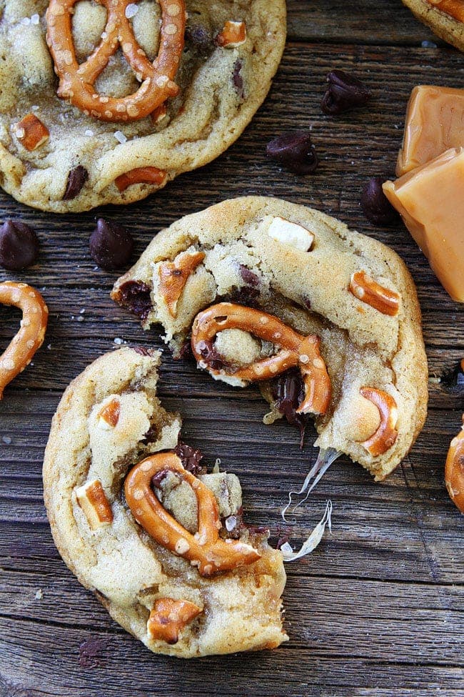 Salted Caramel Pretzel Chocolate Chip Cookie Recipe on twopeasandtheirpod.com Chocolate chip cookies with salted caramel, pretzels, and sea salt! The sweet and salty combo is perfection! Salted Caramel Pretzel Chocolate Chip Cookie Recipe