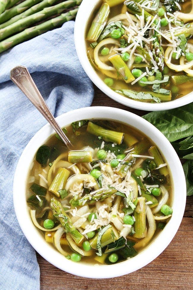 Spring Vegetable Zucchini Noodle Soup Recipe on twopeasandtheirpod.com This fresh and healthy soup is made with zucchini noodles and all of your favorite spring vegetables! Spring Vegetable Zucchini Noodle Soup Recipe