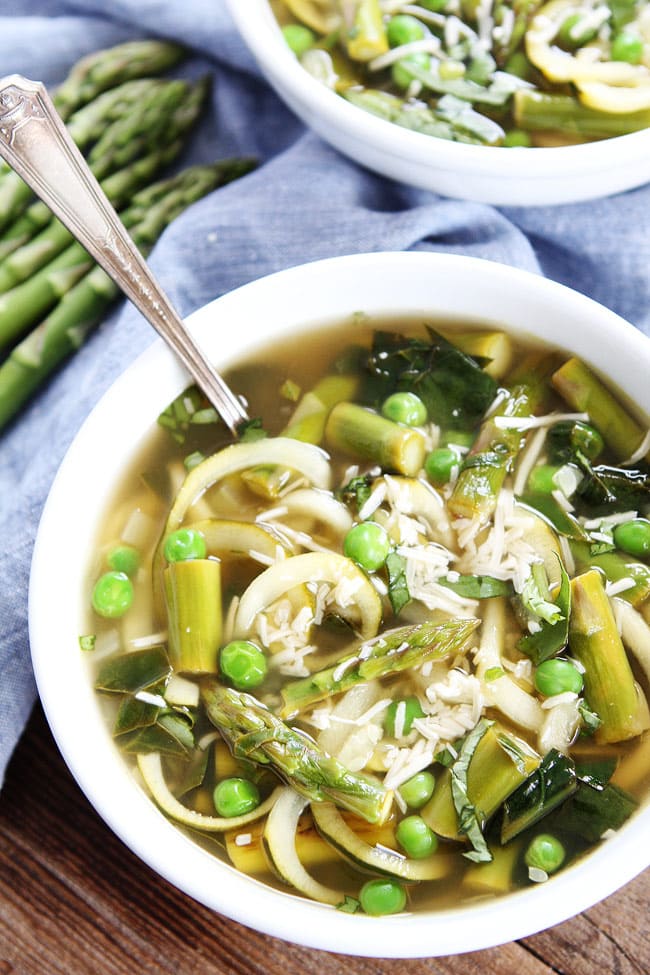 Spring Vegetable Zucchini Noodle Soup Recipe on twopeasandtheirpod.com This fresh and healthy spring soup is gluten-free and vegan! It is great for lunch or dinner. Spring Vegetable Zucchini Noodle Soup Recipe