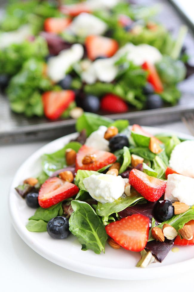 Berry, Burrata, and Almond Salad Recipe on twopeasandtheirpod.com Mixed greens topped with blueberries, strawberries, burrata cheese, almonds, and a simple honey lemon dressing! This is the perfect summer salad! Berry, Burrata, and Almond Salad Recipe
