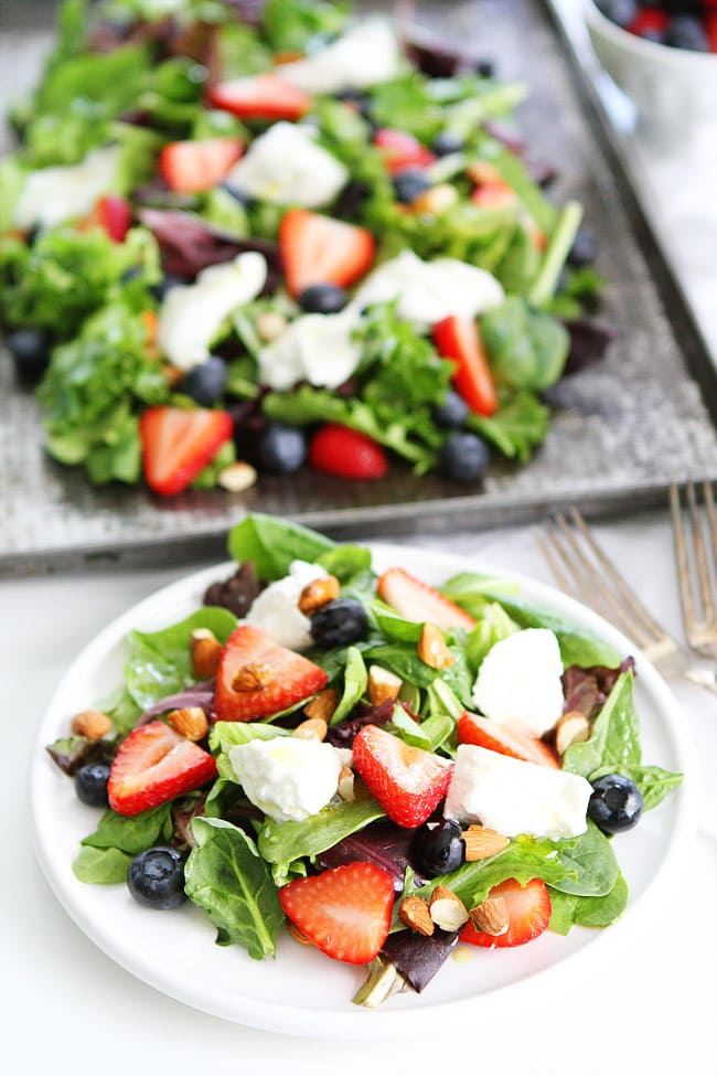 Berry, Burrata, and Almond Salad Recipe on twopeasandtheirpod.com Mixed greens topped with blueberries, strawberries, burrata cheese, almonds, and a simple honey lemon dressing! This salad is perfect for spring and summer! Berry, Burrata, and Almond Salad Recipe