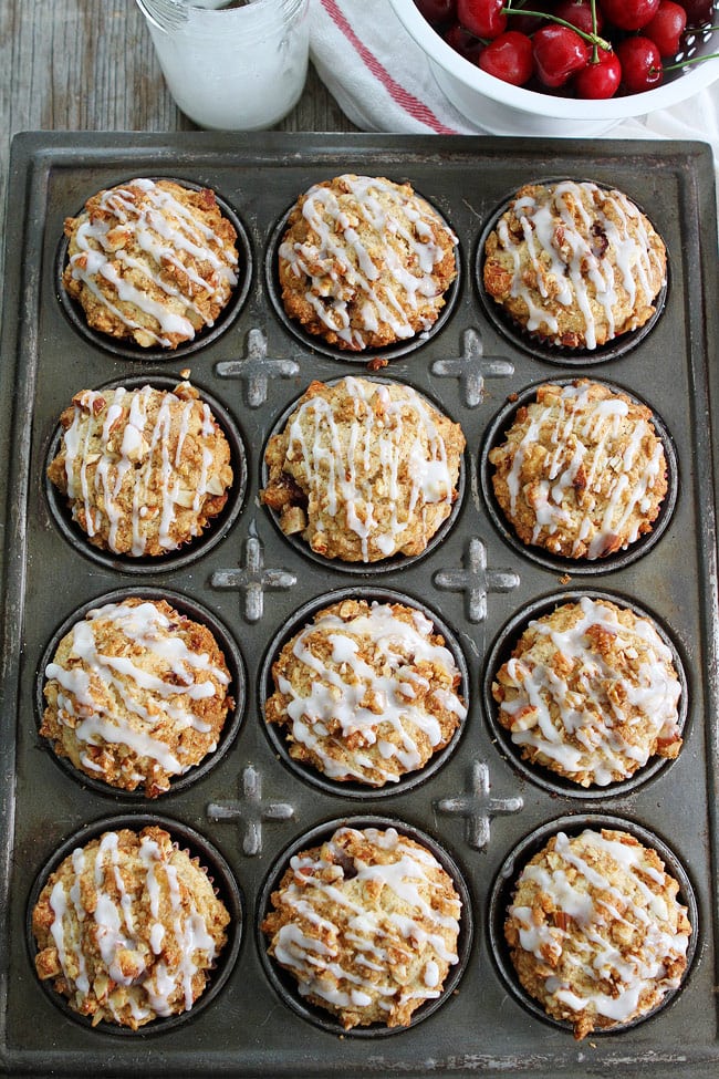 Cherry Almond Streusel Muffins Recipe on twopeasandtheirpod.com Cherry muffins with an almond streusel topping and sweet almond glaze! The BEST muffins ever! Cherry Almond Streusel Muffins Recipe