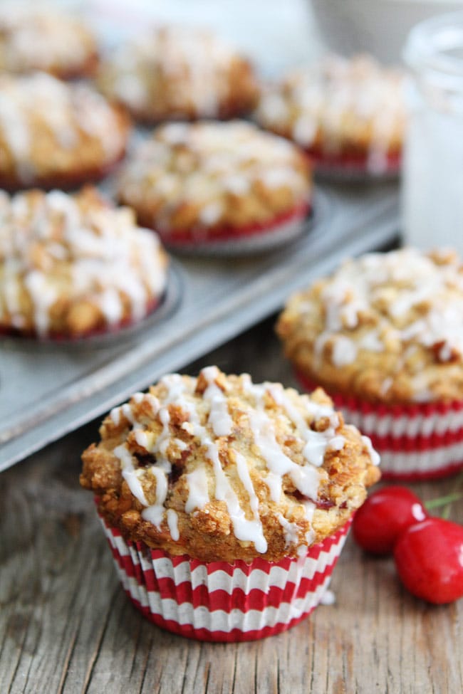 Cherry Almond Streusel Muffins Recipe on twopeasandtheirpod.com Cherry muffins with an almond streusel topping and sweet almond glaze! Cherry Almond Streusel Muffins Recipe