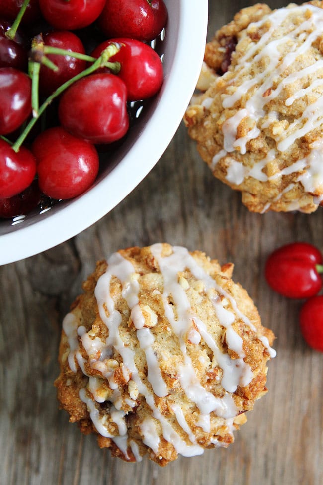 Cherry Almond Streusel Muffins Recipe on twopeasandtheirpod.com Cherry muffins with an almond streusel topping and sweet almond glaze! Everyone LOVES these muffins and they are easy to make too! Cherry Almond Streusel Muffins Recipe