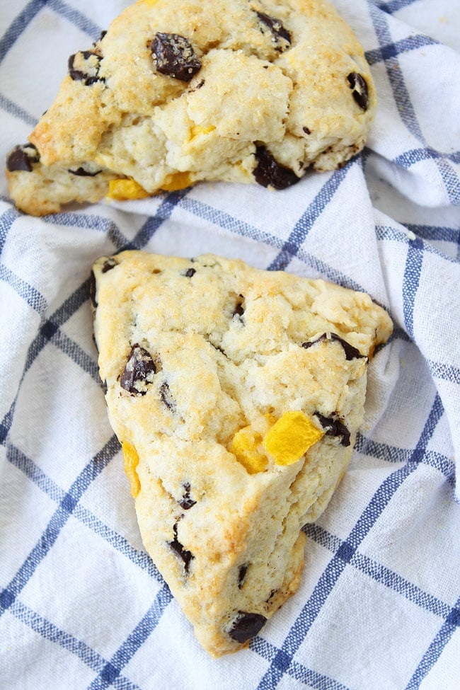 Mango Dark Chocolate Chunk Scones Recipe on twopeasandtheirpod.com Soft, tender, buttery scones with juicy mango pieces and dark chocolate chunks! These scones are amazing! You will love the mango and dark chocolate combo! Mango Dark Chocolate Chunk Scones Recipe