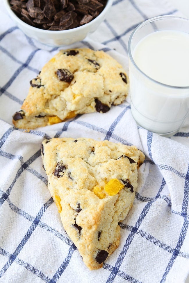 Mango Dark Chocolate Chunk Scones Recipe on twopeasandtheirpod.com Soft, tender, buttery cream scones with juicy mango pieces and dark chocolate chunks! These scones make a great breakfast treat! Mango Dark Chocolate Chunk Scones Recipe