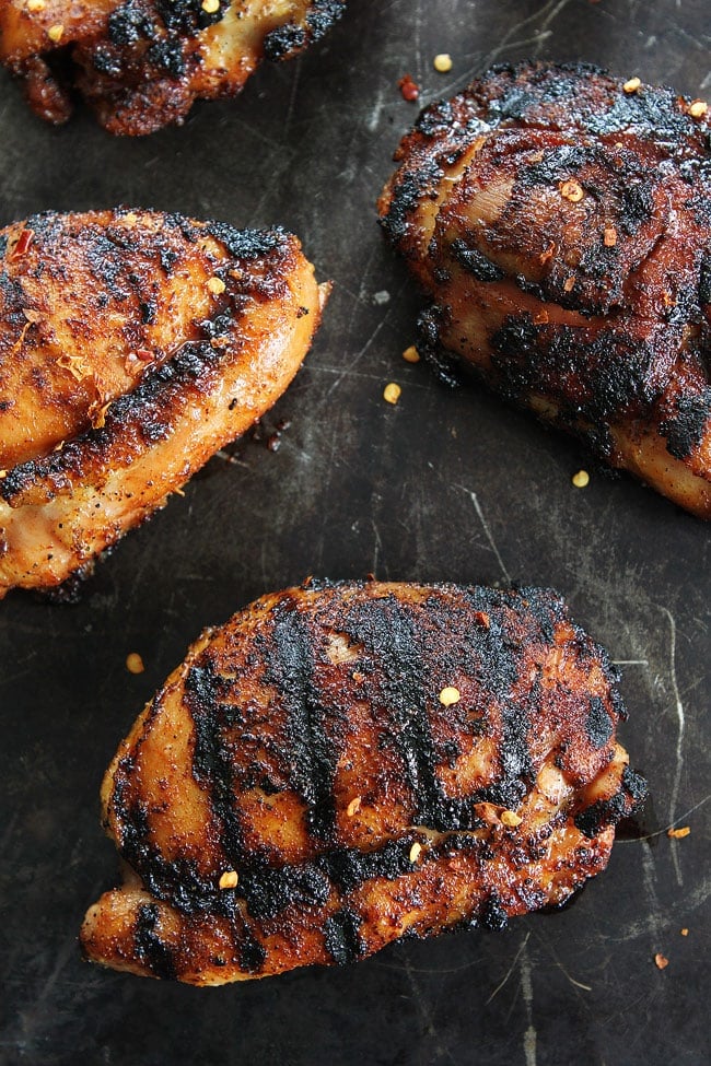 Sweet and Spicy Grilled Chicken Recipe on twopeasandtheirpod.com This easy grilled chicken recipe is a summer favorite! Add it to your dinner menu today! Sweet and Spicy Grilled Chicken Recipe