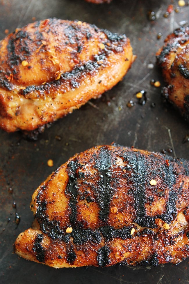 Sweet and Spicy Grilled Chicken Recipe on twopeasandtheirpod.com Get out your grill and make this easy grilled chicken for dinner! It is SO good! Sweet and Spicy Grilled Chicken Recipe