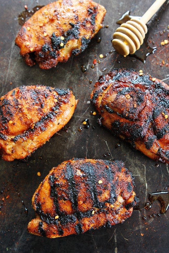 Sweet and Spicy Grilled Chicken Recipe on twopeasandtheirpod.com This easy grilled chicken recipe is a summer favorite! Sweet and Spicy Grilled Chicken Recipe