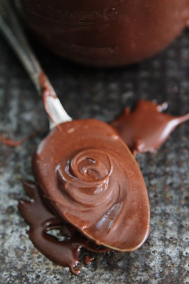 3-Ingredient Peanut Butter Hot Fudge Recipe on twopeasandtheirpod.com This easy hot fudge sauce is great drizzled on ice cream, cake, brownies, or fruit. The peanut butter addition is AMAZING! 3-Ingredient Peanut Butter Hot Fudge Recipe