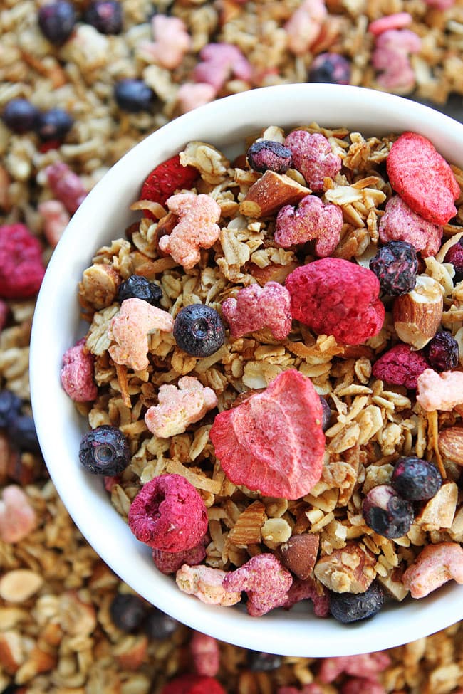 Berry Granola Recipe on twopeasandtheirpod.com This easy homemade granola is bursting with berries. It is great for breakfast, snack time, or even dessert! Berry Granola Recipe
