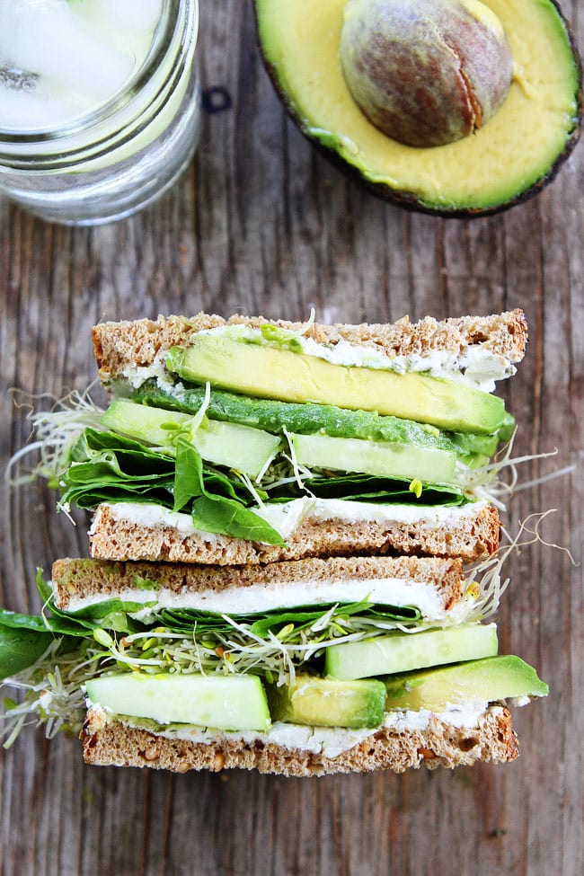 Cucumber and Avocado Sandwich Recipe on twopeasandtheirpod.com This fresh and simple vegetarian sandwich is made with cucumber, avocado, lettuce, sprouts, and herbed goat cheese. It is great for lunch or dinner. Cucumber and Avocado Sandwich Recipe