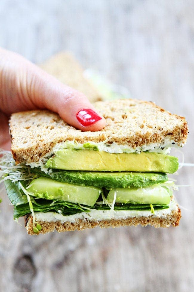 Cucumber and Avocado Sandwich Recipe on twopeasandtheirpod.com This fresh and healthy sandwich is made with cucumber, avocado, lettuce, sprouts, and herbed goat cheese. Cucumber and Avocado Sandwich Recipe