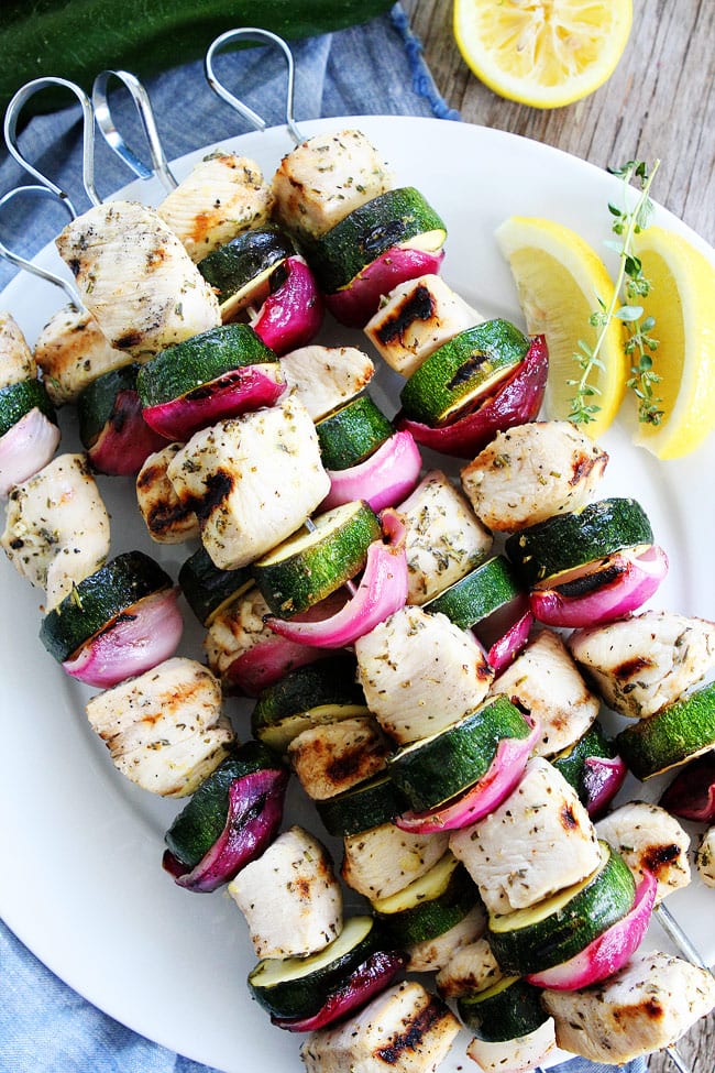 Grilled Chicken and Zucchini Kebabs Recipe on twopeasandtheirpod.com Easy grilled chicken and zucchini kebabs with a simple lemon herb marinade. This recipe is a summer favorite! easy chicken and zucchini kabobs on plate