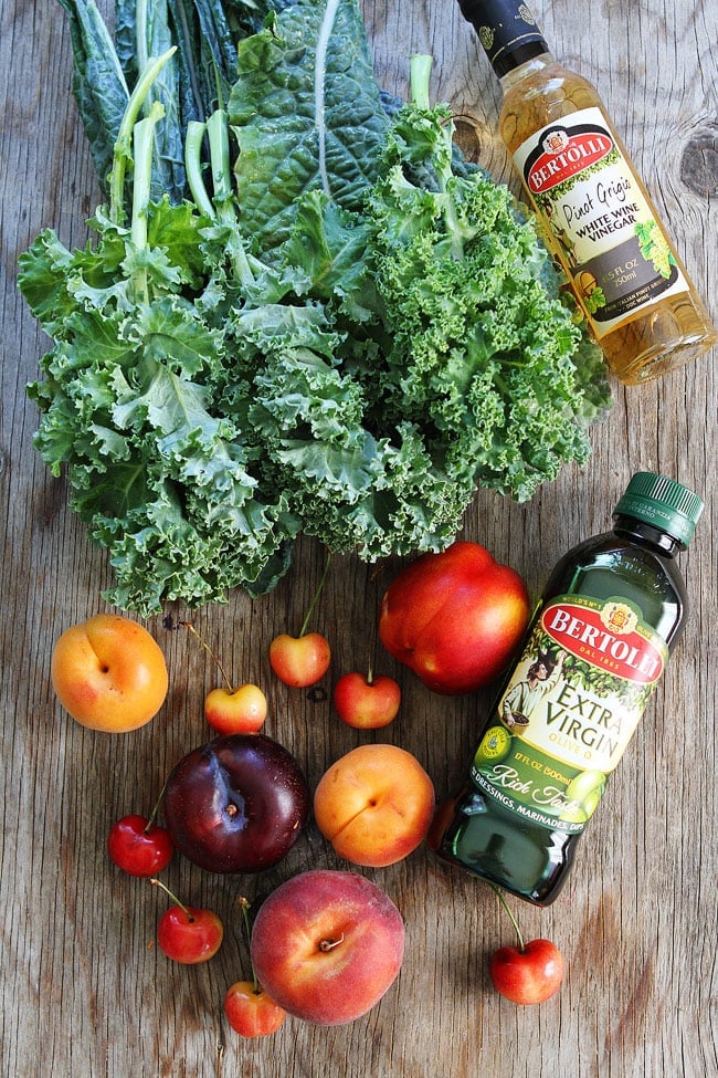 Stone Fruit Kale Salad Recipe on twopeasandtheirpod.com This simple kale salad is loaded with summer stone fruit, goat cheese, and pistachios. Stone Fruit Kale Salad Recipe