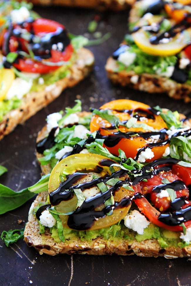 Avocado, Tomato, and Goat Cheese Toast Recipe on twopeasandtheirpod.com Avocado toast with tomatoes, goat cheese, arugula, basil, and a drizzle of balsamic glaze. The perfect avocado toast for summertime or anytime! Avocado, Tomato, and Goat Cheese Toast Recipe