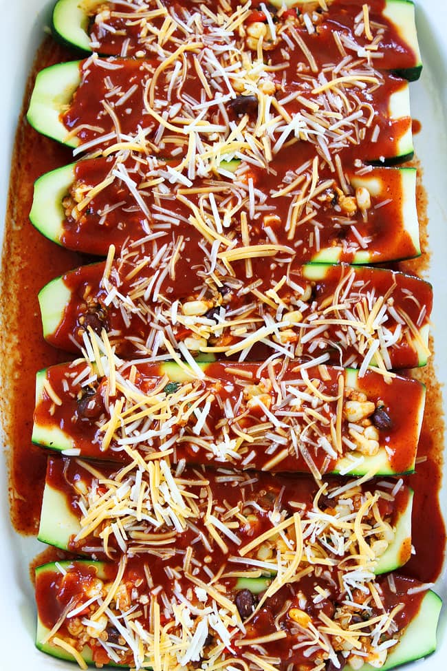 Black Bean and Quinoa Enchilada Zucchini Boats Recipe on twopeasandtheirpod.com If you like enchiladas, you will love these easy enchilada zucchini boats. The BEST way to use up your summer zucchini! Black Bean and Quinoa Enchilada Zucchini Boats Recipe