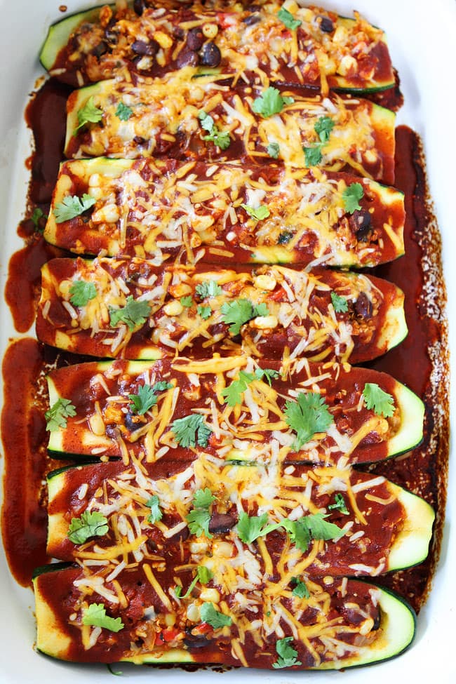 Black Bean and Quinoa Enchilada Zucchini Boats Recipe on twopeasandtheirpod.com One of our favorite family meals and the kids love it too! Add this easy recipe to your dinner menu ASAP! Black Bean and Quinoa Enchilada Zucchini Boats Recipe