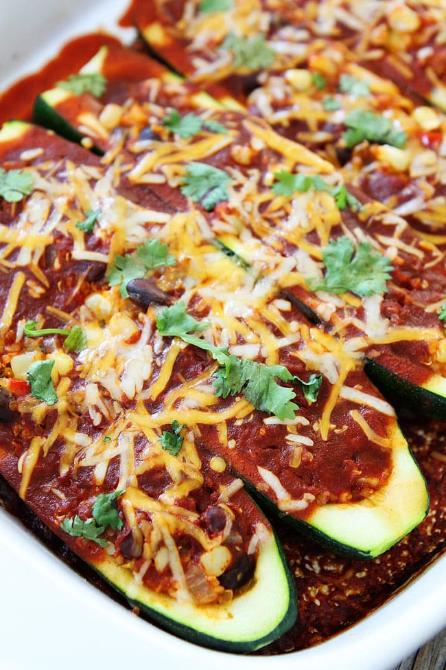 Black Bean and Quinoa Enchilada Zucchini Boats Recipe on twopeasandtheirpod.com If you like enchiladas, you will love these easy enchilada zucchini boats. The BEST way to use up your summer zucchini! Black Bean and Quinoa Enchilada Zucchini Boats