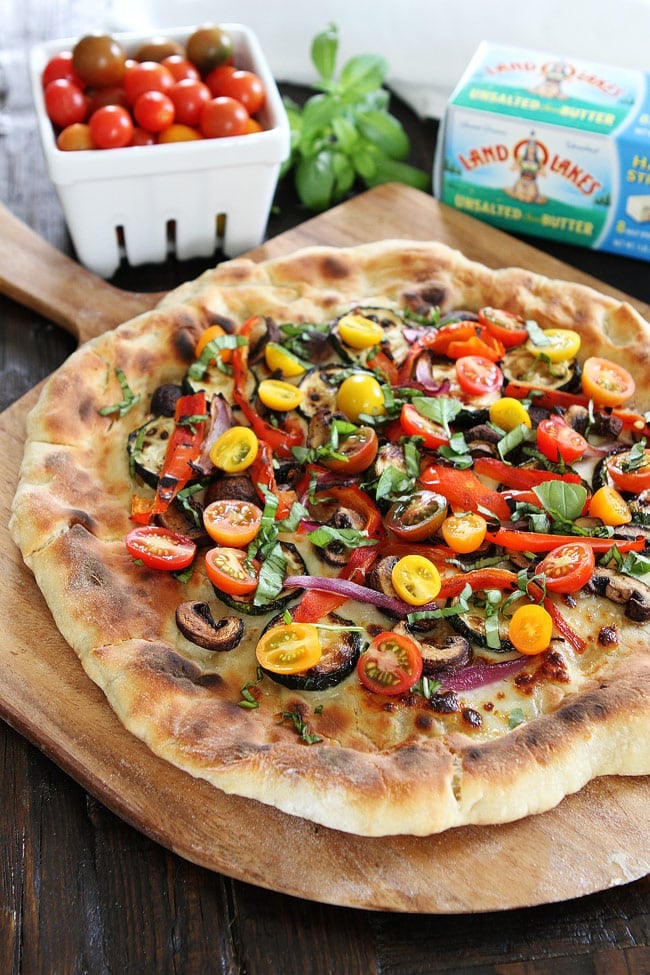 Garlic Butter Grilled Vegetable Pizza Recipe on twopeasandtheirpod.com Pizza brushed with garlic butter and topped with grilled vegetables, fresh mozzarella, and basil. Garlic Butter Grilled Vegetable Pizza Recipe