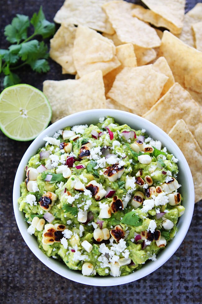 Grilled Corn Guacamole Recipe on twopeasandtheirpod.com You will love this easy guacamole with grilled sweet corn. It is great with chips or served with tacos, burritos, enchiladas, or salads. Grilled Corn Guacamole Recipe