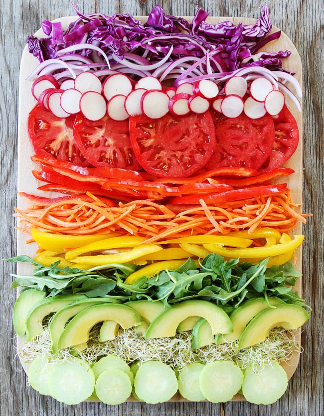 Rainbow Vegetable Sandwich Recipe on twopeasandtheirpod.com This healthy and delicious sandwich is layered with colorful veggies. It is the ultimate veggie sandwich! Rainbow Vegetable Sandwich Recipe