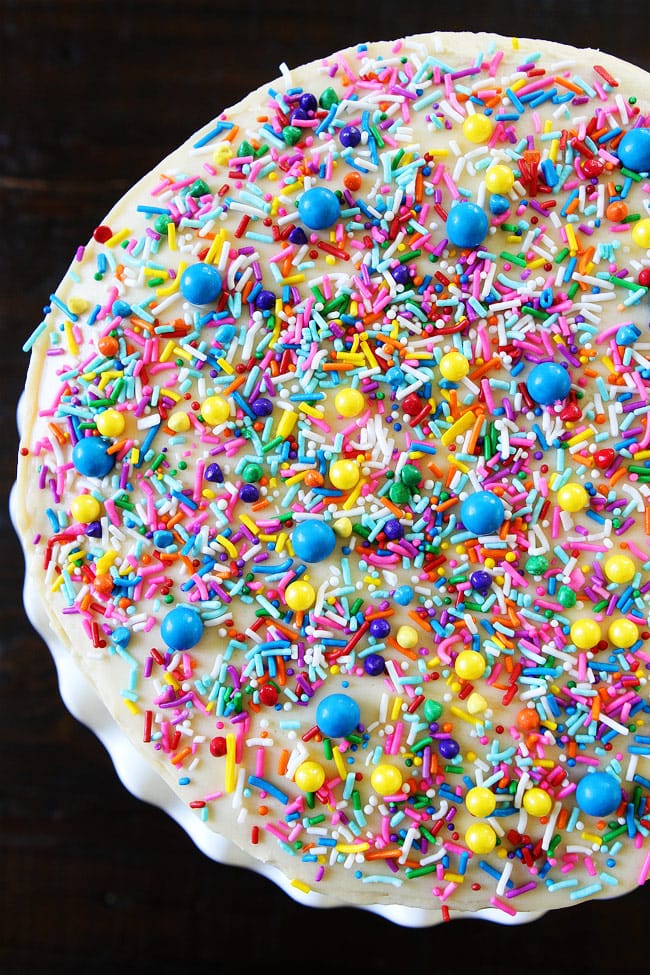 Funfetti Cake Recipe on twopeasandtheirpod.com White layer cake with sprinkles and a sweet vanilla buttercream frosting. This sprinkle cake is SO fun! Funfetti Birthday Cake From Top