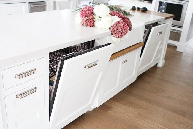 White Kitchen with Two Islands on twopeasandtheirpod.com This kitchen has 2 dishwashers, 2 sinks, 2 ovens, and 2 refrigerators. It is the perfect kitchen! White Kitchen