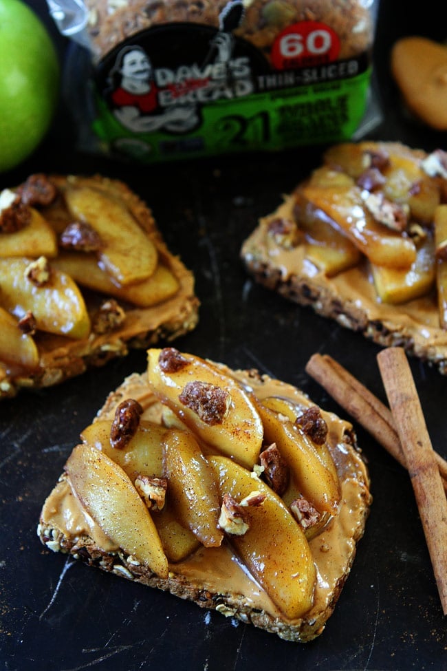 Peanut Butter Toast with Skillet Cinnamon Apples Recipe on twopeasandtheirpod.com Peanut butter toast topped with warm skillet cinnamon apples. This simple and decadent toast is perfect for fall! Peanut Butter Toast with Skillet Cinnamon Apples Recipe