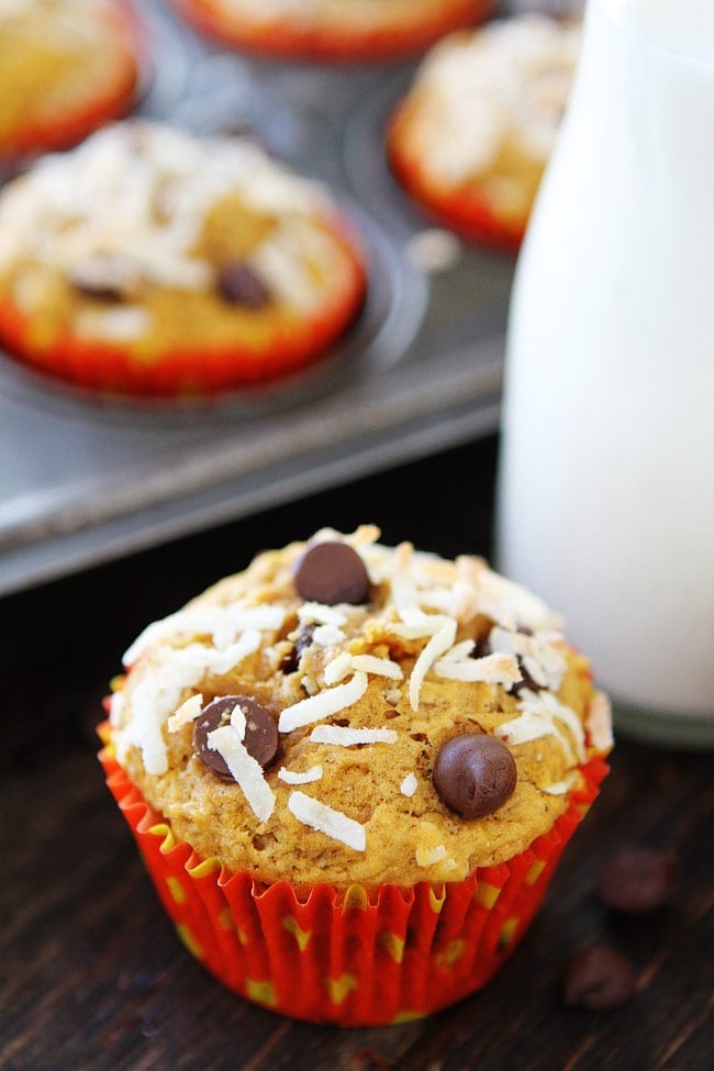 Pumpkin Coconut Chocolate Chip Muffins Recipe on twopeasandtheirpod.com Moist pumpkin muffins with coconut and chocolate chips. You will love these easy fall muffins! Pumpkin Coconut Chocolate Chip Muffins Recipe