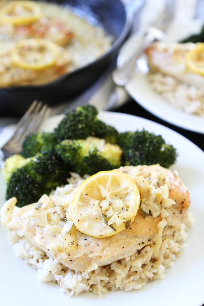 Skillet Creamy Lemon Rosemary Chicken Recipe on twopeasandtheirpod.com This quick and easy one-skillet chicken dish is great for busy weeknights or easy entertaining. Skillet Creamy Lemon Rosemary Chicken Recipe