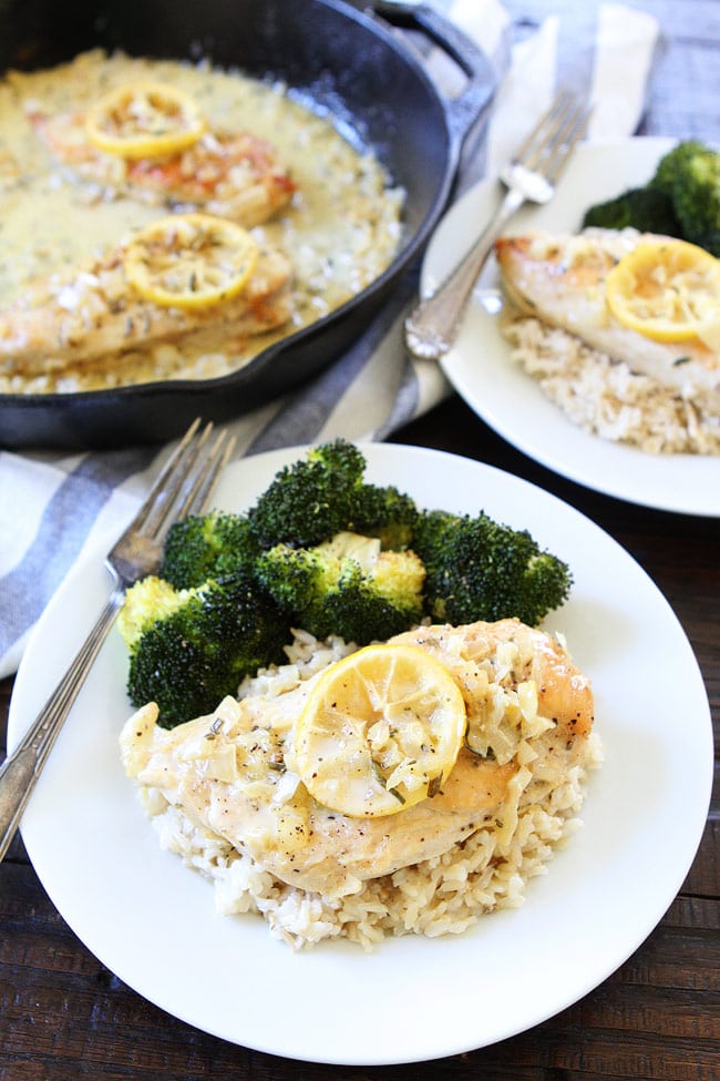 Skillet Creamy Lemon Rosemary Chicken Recipe on twopeasandtheirpod.com This quick and easy one-skillet chicken dish is great for busy weeknights or easy entertaining. Skillet Creamy Lemon Rosemary Chicken Recipe