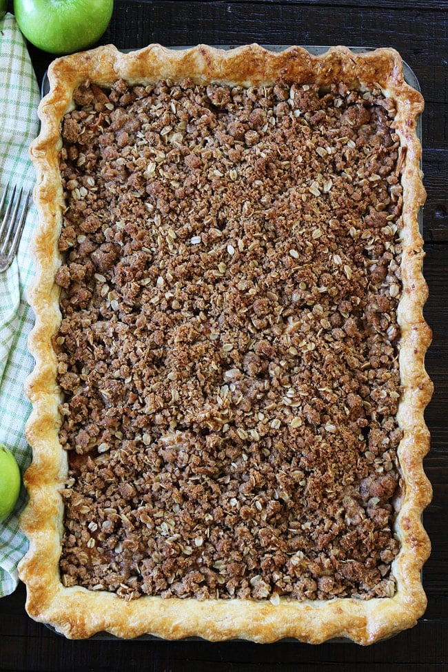 Apple Slab Pie with Crumb Topping Recipe on twopeasandtheirpod.com This easy apple pie is made in a jelly roll pan and is perfect for feeding a crowd. It is our family's favorite dessert. Apple Slab Pie with Crumb Topping Recipe