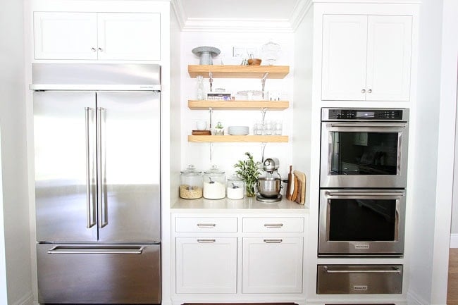 White Kitchen on twopeasandtheirpod.com The perfect white kitchen. with double ovens, two refrigerators, two dishwashers, two islands, two sinks, and open shelving. White Kitchen