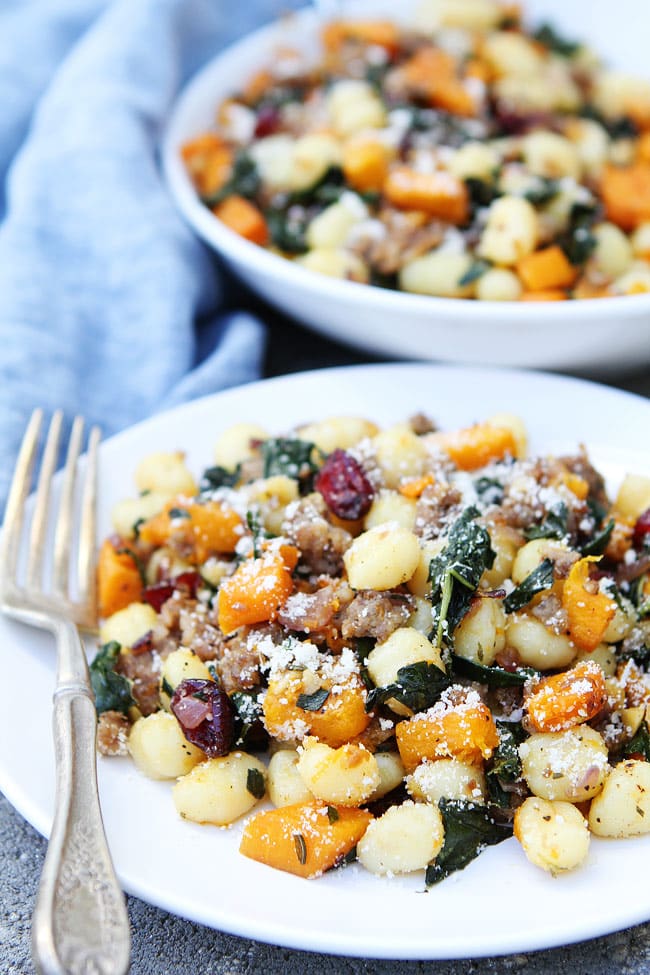 Butternut Squash, Sausage, and Kale Gnocchi Recipe on twopeasandtheirpod.com Gnocchi with roasted butternut squash, sausage, kale, dried cranberries, rosemary, and Parmigiano Reggiano cheese. The perfect fall meal! Butternut Squash, Sausage, and Kale Gnocchi Recipe