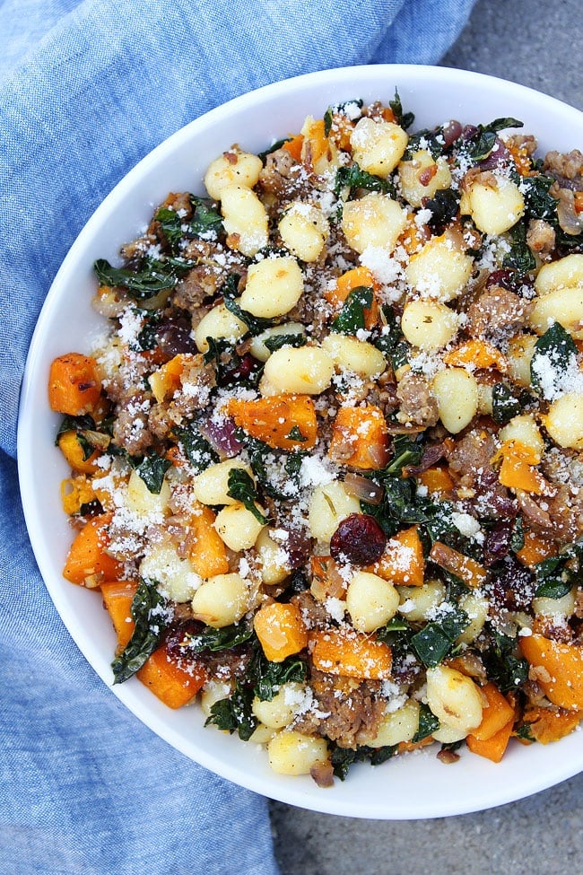 Butternut Squash, Sausage, and Kale Gnocchi Recipe on twopeasandtheirpod.com Gnocchi with roasted butternut squash, sausage, kale, dried cranberries, rosemary, and Parmigiano Reggiano cheese. The perfect fall meal! Butternut Squash, Sausage, and Kale Gnocchi Recipe