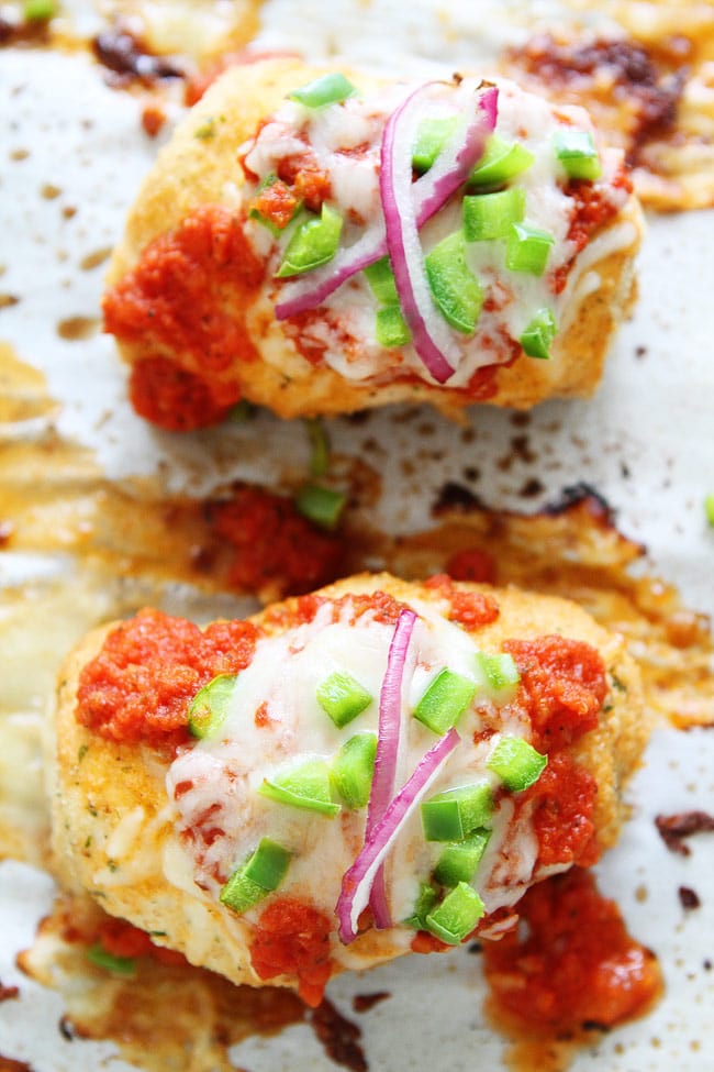 Pizza Stuffed Chicken Roll-Ups Recipe on twopeasandtheirpod.com This quick and easy chicken dinner is a family favorite. Pizza Stuffed Chicken Roll-Ups on sheet pan