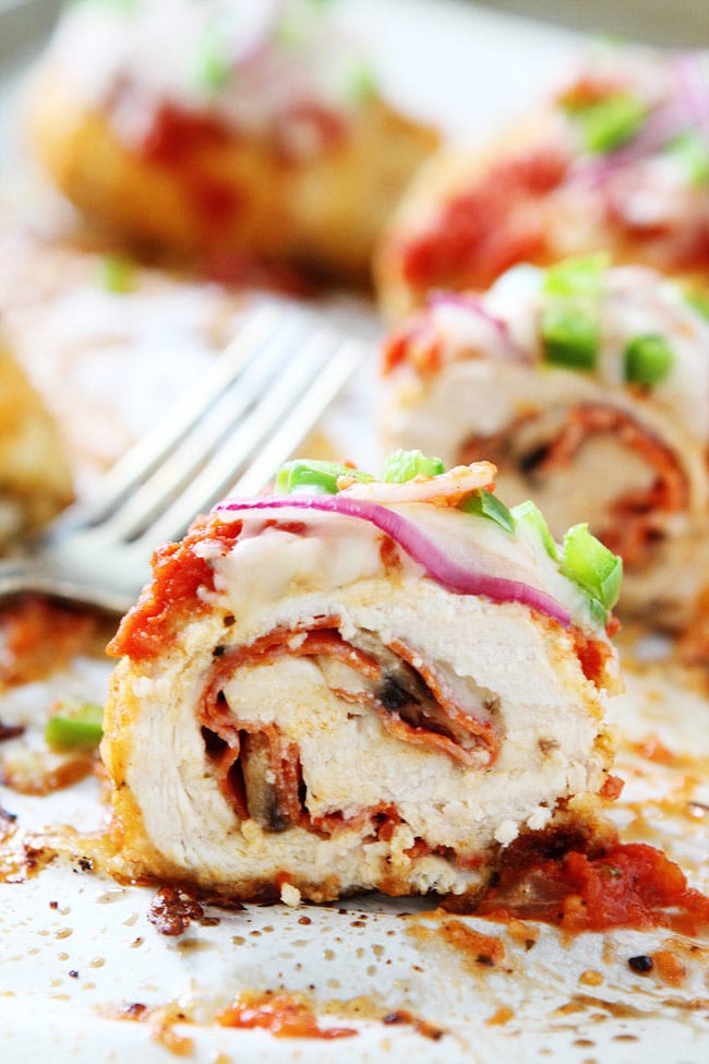 Pizza Stuffed Chicken Roll-Ups Recipe on twopeasandtheirpod.com This easy chicken dinner is a family favorite. Kids and adults love them! Pizza Stuffed Chicken Roll-Ups Recipe