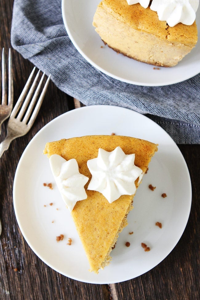 Pumpkin Cheesecake with Brown Butter Gingersnap Crust Recipe on twopeasandtheirpod.com This is the BEST cheesecake recipe! Your friends and family will love it! Add it to your Thanksgiving menu now! Pumpkin Cheesecake Recipe