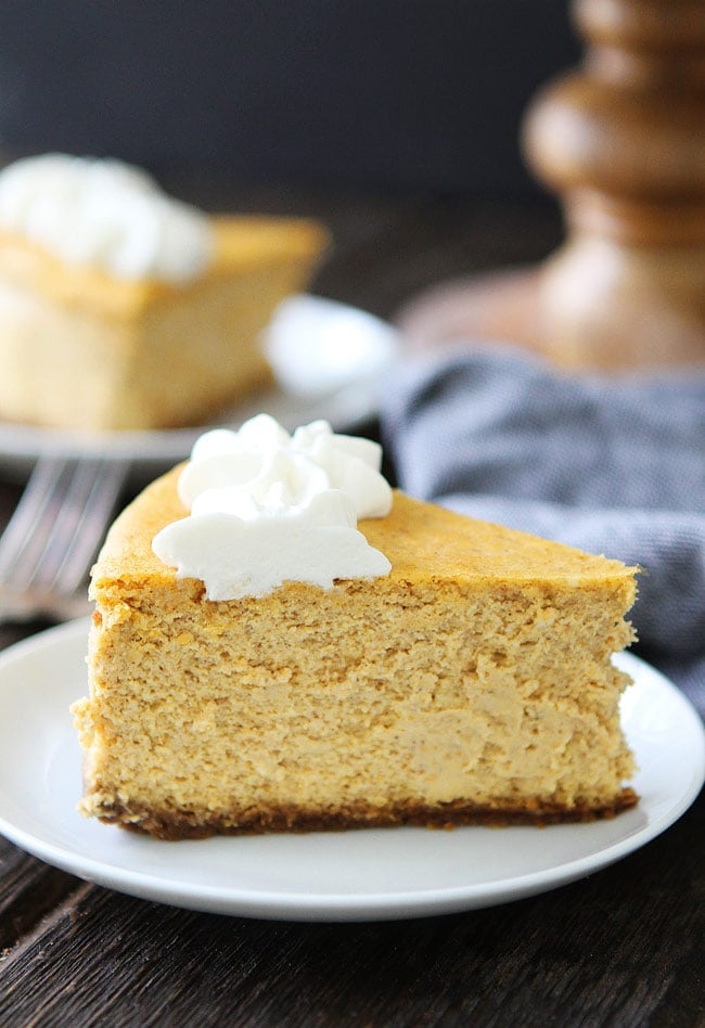 Pumpkin Cheesecake with Brown Butter Gingersnap Crust Recipe on twopeasandtheirpod.com This creamy and rich pumpkin cheesecake is perfect for fall and holiday celebrations. The brown butter gingersnap crust is perfection! Pumpkin Cheesecake Recipe