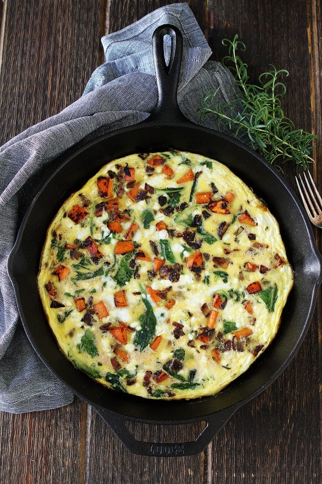 Sweet Potato, Kale, and Goat Cheese Frittata Recipe on twopeasandtheirpod.com This easy one skillet frittata is great for breakfast, lunch, or dinner. Sweet Potato, Kale, and Goat Cheese Frittata in cast iron skillet.