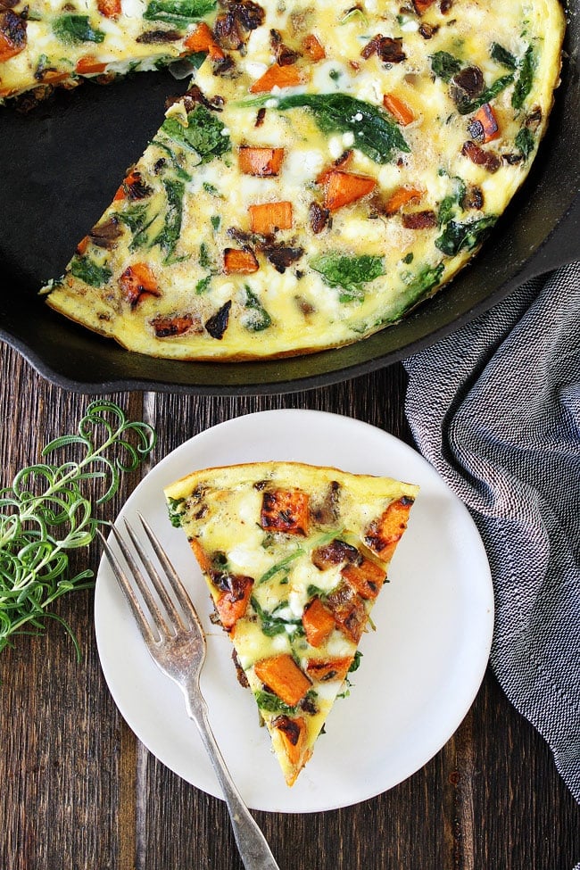 Sweet Potato, Kale, and Goat Cheese Frittata Recipe on twopeasandtheirpod.com This easy one skillet frittata is great for breakfast, lunch, or dinner. Sweet Potato, Kale, and Goat Cheese Frittata on plate.