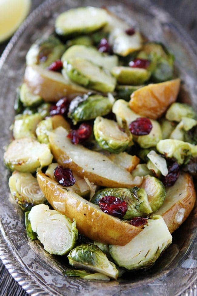 Roasted Pear and Cranberry Brussels Sprouts Recipe on twopeasandtheirpod.com Crispy Brussels sprouts with sweet roasted pears, dried cranberries, lemon, and honey. This simple side dish goes great with any meal. Roasted Pear and Cranberry Brussels Sprouts Recipe